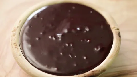 Strawberry going into chocolate slow motion Stock Footage 61799302