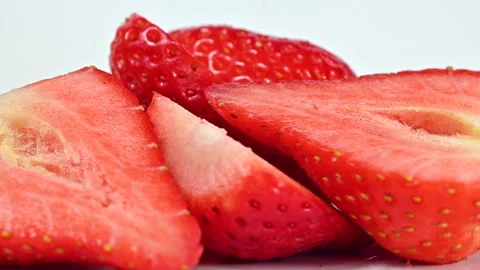Strawberry halves on white background macro close up Stock Footage 301570079