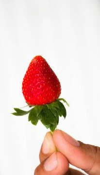 Strawberry on hand Stock Photos