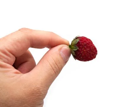 Strawberry in hand on white background Stock Photos