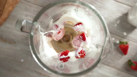Strawberry Ice Cream Milkshake Mixed in Blender - Top View, Camera Moves Out Stock Footage