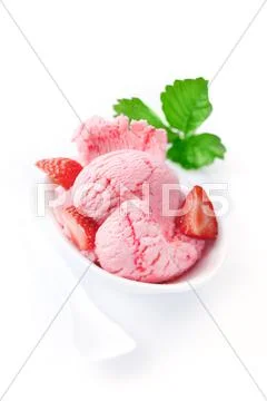 Strawberry icecream garnished with fresh fruit Stock Photos