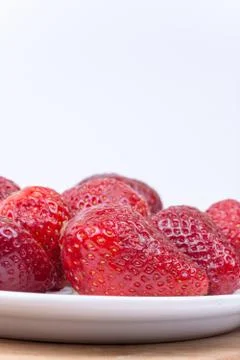 Strawberry image with copy space over white background Stock Photos