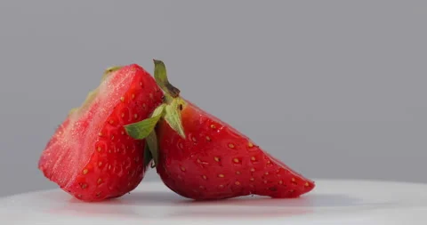 Strawberry Interior in a Rotating Macro on White Vídeo Stock 135632980