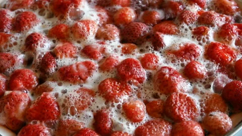 Strawberry jam cooking background, closeup, strawberries simmer in a pan Stock Footage 134252077