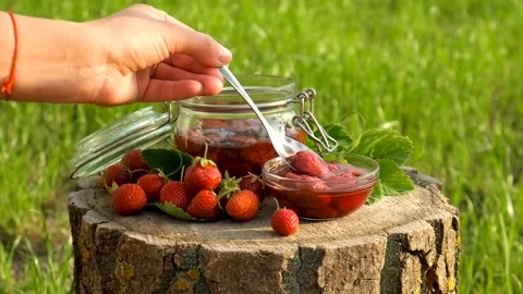 Strawberry jam in the garden. Selective focus. Stock Footage 245372723