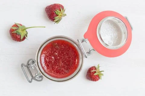 Strawberry jam in a jar on wood Stock Photos