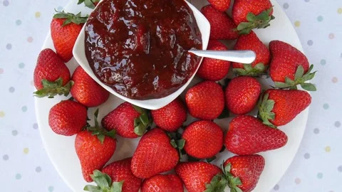 Strawberry jam on a plate. Stock Footage 245681690