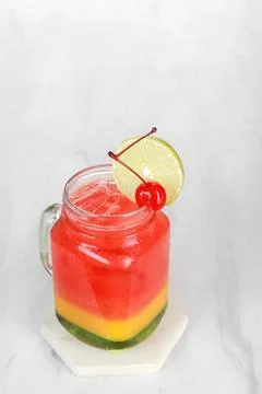 Strawberry juice drink in a clear glass with gradation in the glass and che.. Stock Photos