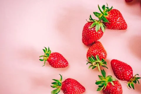 Strawberry on the light pink background. Stock Photos