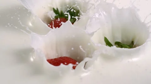 Strawberry in milk, Slow Motion Stock Footage