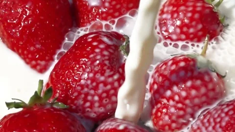 Strawberry in milk. Slow motion. Stock Footage 83271320