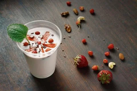 Strawberry milkshake over rustic background Stock-Fotos