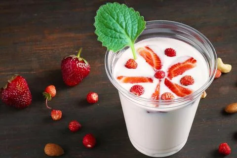 Strawberry milkshake over rustic background 스톡 사진