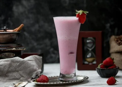 Strawberry milkshake on the table Stock Photos