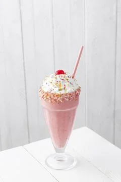 Strawberry milkshake on table Stock Photos