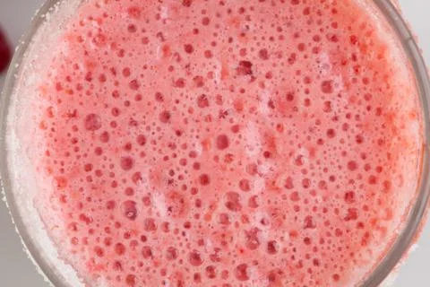 Strawberry milkshake texture. Background. Macro. Stock Photos