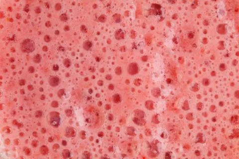 Strawberry milkshake texture. Background. Macro. Stock Photos