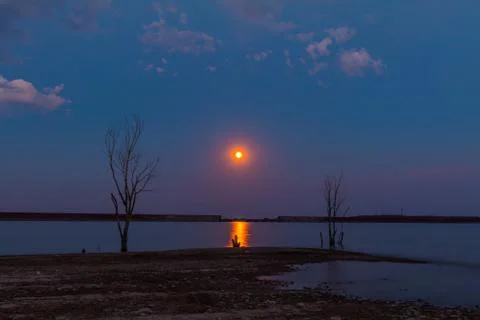 Strawberry Moon Over The Reservoir Stock Photos