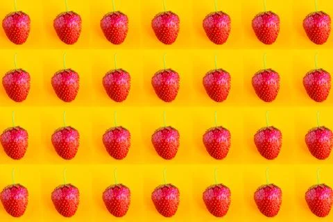 Strawberry pattern on bright orange background, top view Stock Photos
