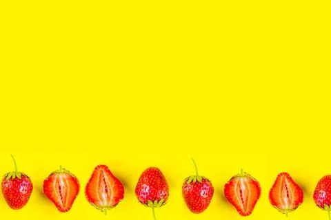 Strawberry pattern on bright yellow background, copy space for the text Stock Photos