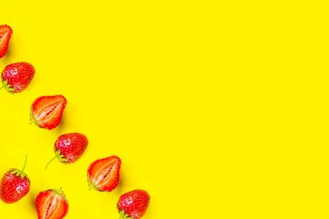 Strawberry pattern on bright yellow background, copy space for the text Stockfoto's