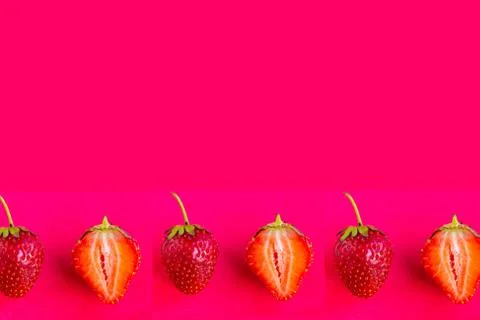 Strawberry pattern on dark red background, copy space for the text Stock Photos
