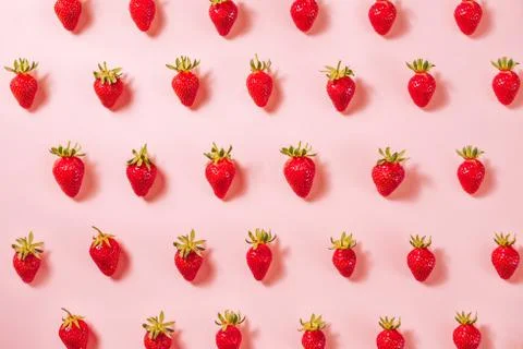 Strawberry pattern on the light pink background. Stock Photos