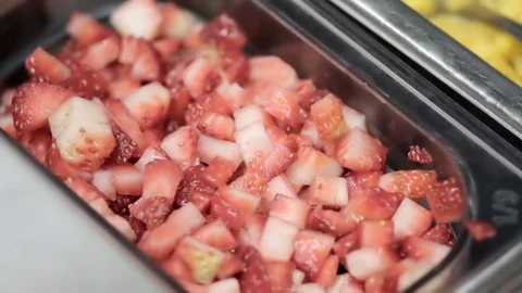 Strawberry pieces on a restaurant container Stock Footage 109377893