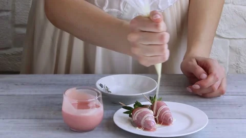 Strawberry in pink chocolate decorting with white chocolate.Step 2 Stock Footage 150116238