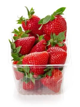 Strawberry in plastic container box isolated on white Stock Photos