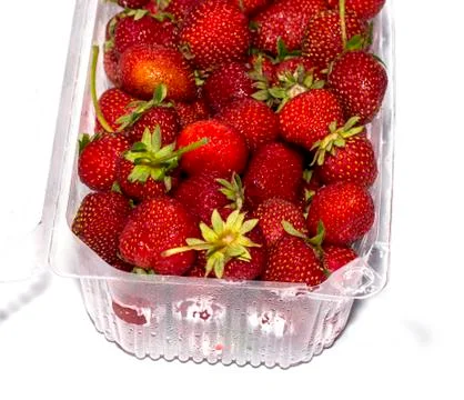 Strawberry in the plastic container a side view Stock Photos