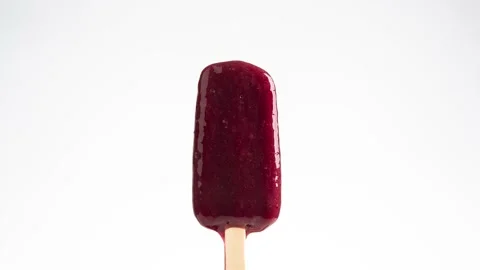 Strawberry popsicle melting timelapse Stock Footage 235457094