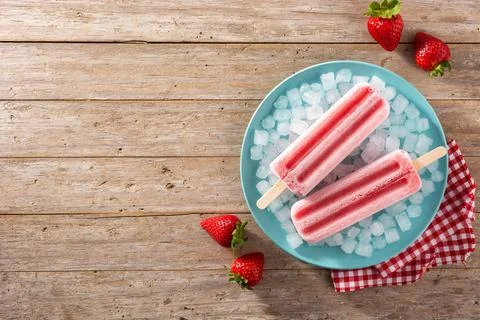 Strawberry popsicles with ice Stock Photos