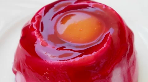 Strawberry pudding with orange jam on top Stock Footage 54340544