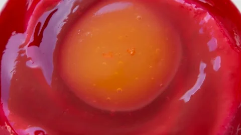 Strawberry pudding with orange jam on top, closeup Stock Footage 54340824