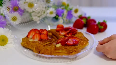 Strawberry puff pastries removed from plastic takeaway box by female hand Stock Footage 344895055