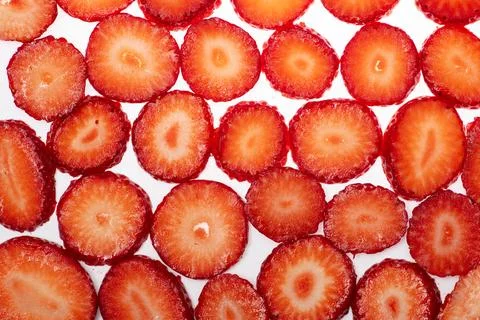Strawberry red slice on white. Texture of a strawberrys surface. Strawberries Stock Photos