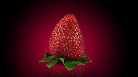 Strawberry with reflection, dark background with red glow, looped rotation Stock Footage 86547829