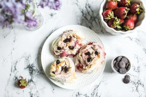 Strawberry rolls with dark chocolate Stock Photos
