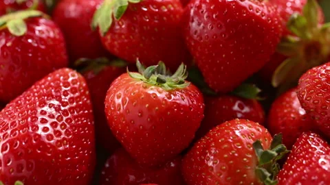 Strawberry rotating in dappled summer sunlight. Видео 330060075