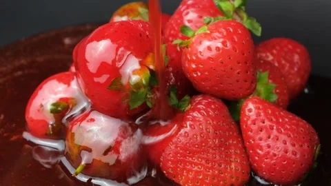 Strawberry sauce coating stack of fresh ripe berries in slow motion Stock Footage 342027746