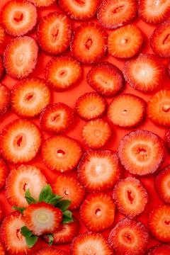 Strawberry slice on red background. sliced strawberries Stock Photos
