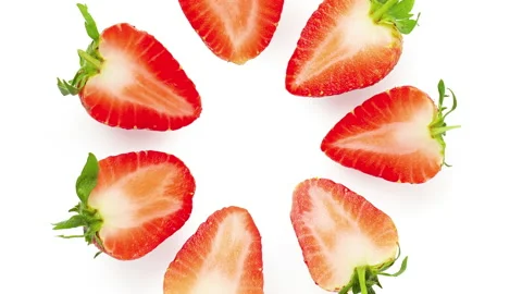 Strawberry slice rotation on a white background 스톡 동영상 145484504