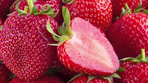 Strawberry slice on strawberry fruit background. panning motion. Stock Footage 145482604