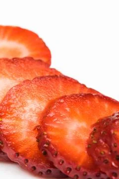 Strawberry slice on white background Stock Photos