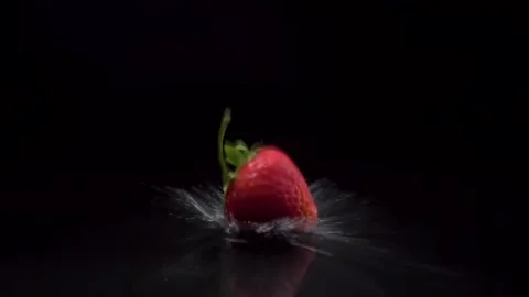 Strawberry slow motion closeup falling in water with Splash droplets Stock Footage 132988852