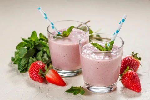 Strawberry smoothie in glasses Stock Photos