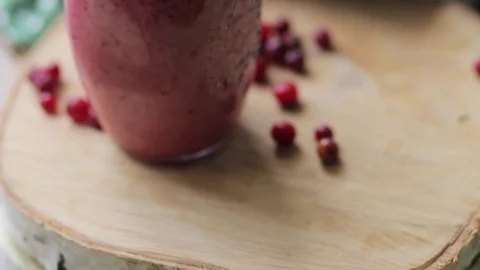 Strawberry smoothies in hand Stock Footage 73661988