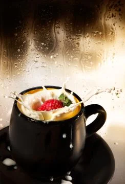 Strawberry splash in milk. Stock Photos